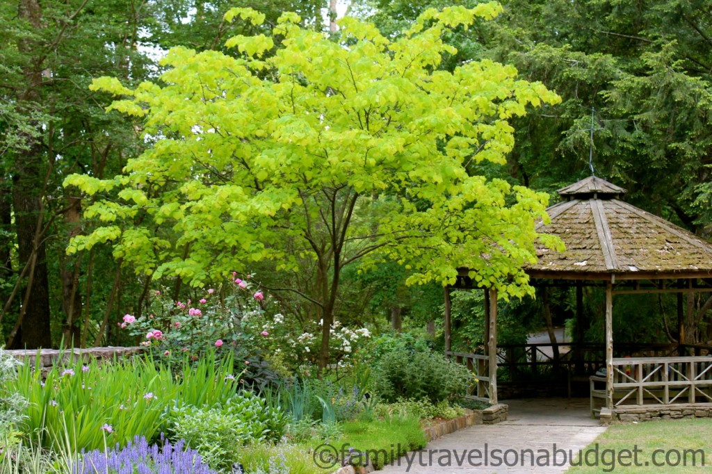 Botanical gardens in Birmingham, Alabama has a variety of gardens and structures, including this relaxed garden space with shade trees and wildflowers and a gazebo.