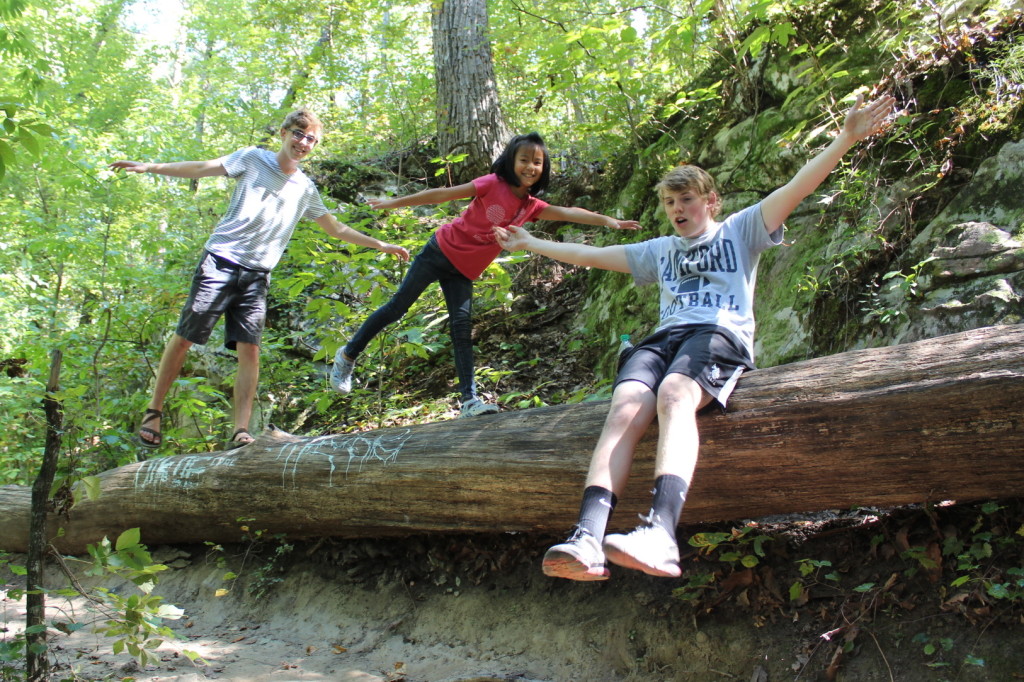 Kids on a log in the forests of Birmingham, Alabama