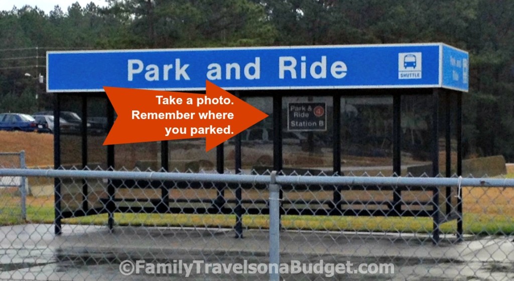 Photo of an airport shuttle station with an orange arrow that says, "Take a photo. Remember where you parked."