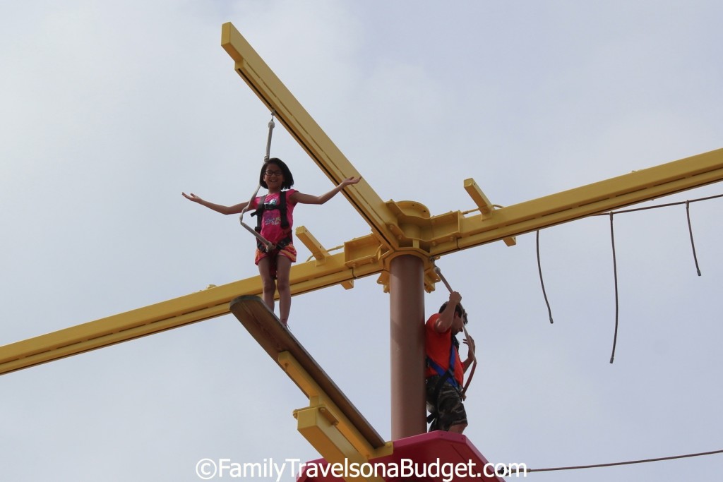 Girl on the ropes course for kids at Lulu's at Gulf Shores