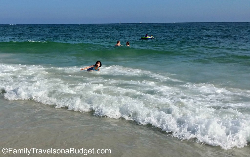 Girl playing in the waves at Orange Beach.