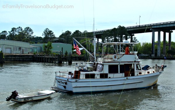 Deep sea fishing boat pulling a small fishing boat