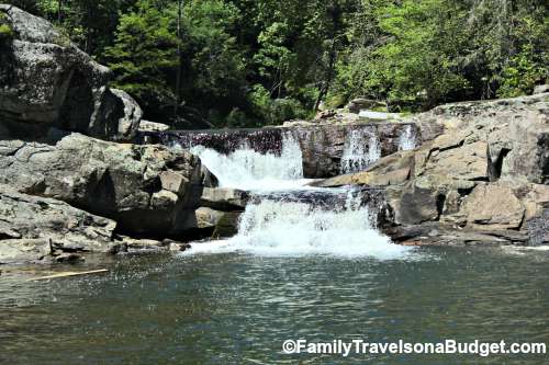 Linville Falls Hiking Trail in North Carolina, a waterfall and pool at the base of the trail.