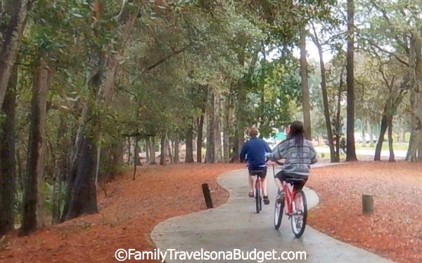 Biking along the miles of bike trails under the trees at Hilton Head Island.