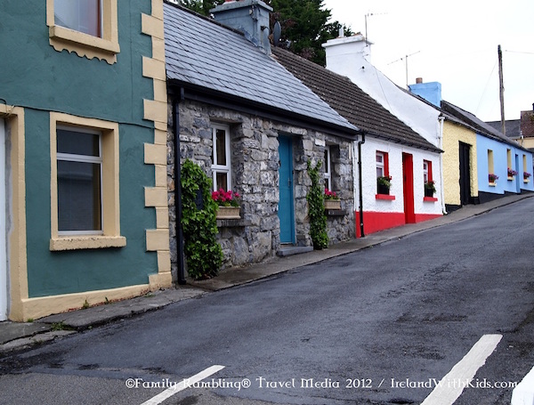 Row of colorful houses along a street in Cong Village, Ashford Castle. Ireland travel tips: Consider a house like this