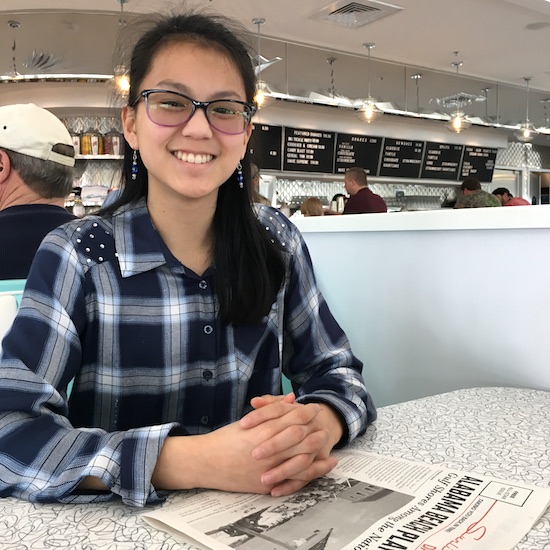 Smiling while waiting for breakfast at the Sunliner Diner in Gulf Shores.