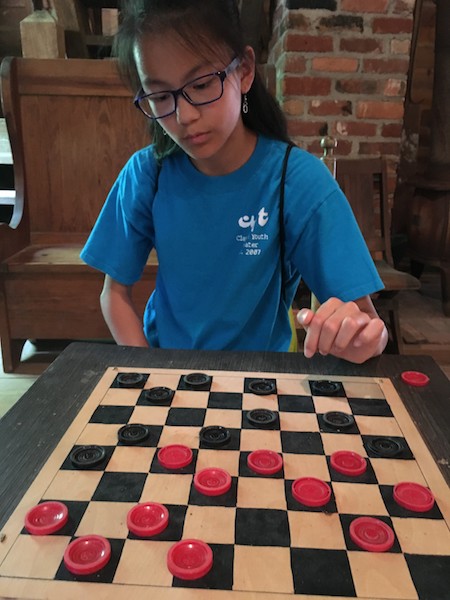 Playing Checkers in a historic building at West Point on the Eno.