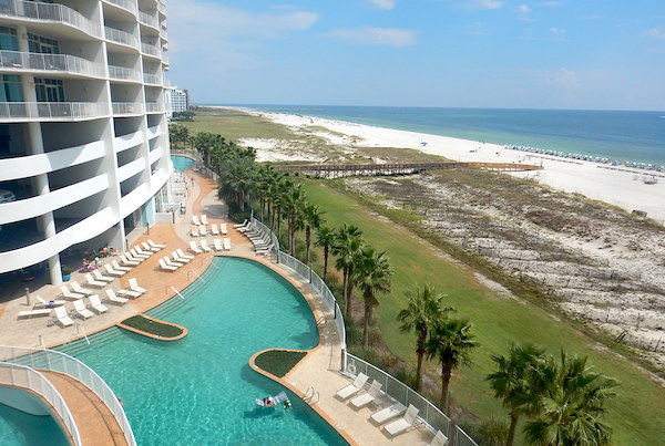 View of the pool and beach at Turquoise Place in Orange Beach