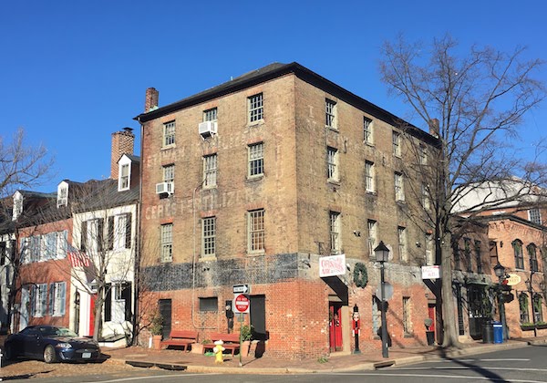 Historic buildings house boutiques and gift shops in Old Town Alexandria.