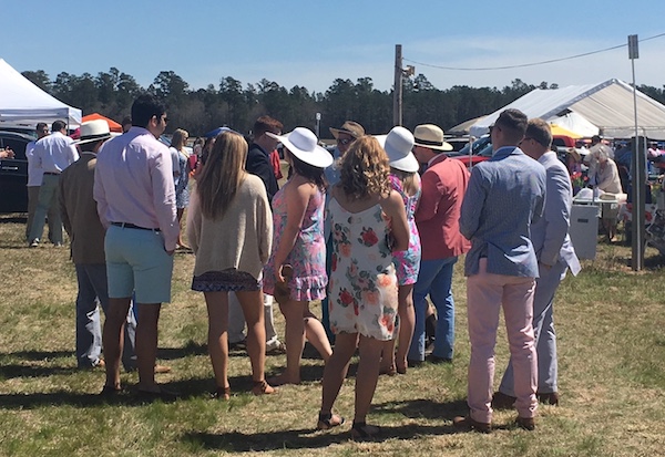 Carolina Cup attire -- hats, dresses and blue seersucker are standard