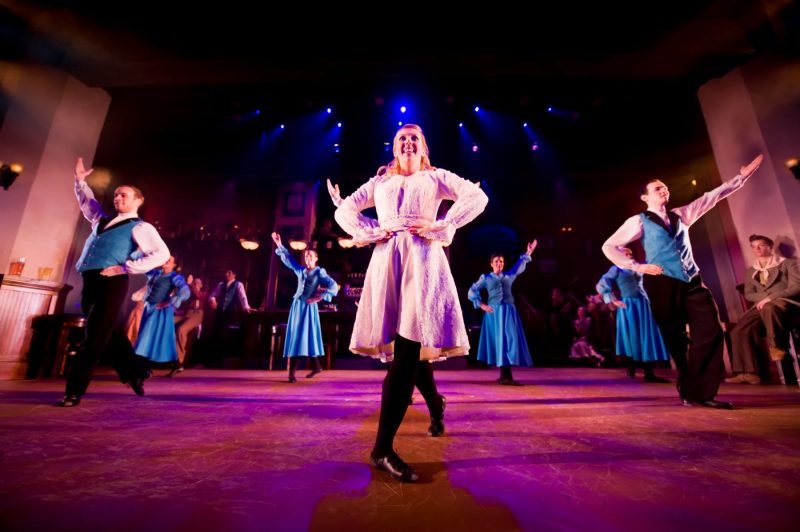 Irish dancers of Celtic Fyre at Busch Gardens, with lead dancer in pink and dancers behind in blue