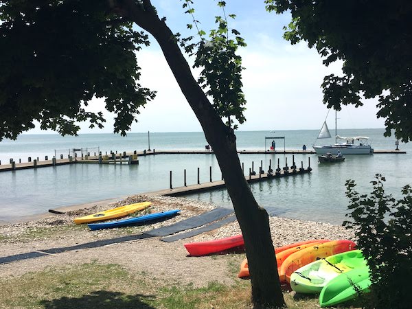 Colorful kayaks lined up on the shore at Put In Bay, Ohio.