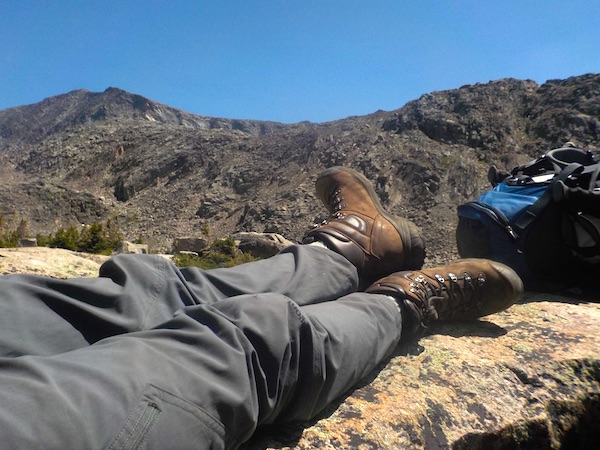 mountain hike showing hikers legs and hiking boots