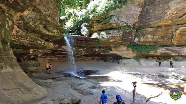 Kids playing in a basin near a waterfall at Starved Rock State Park in Illinois.