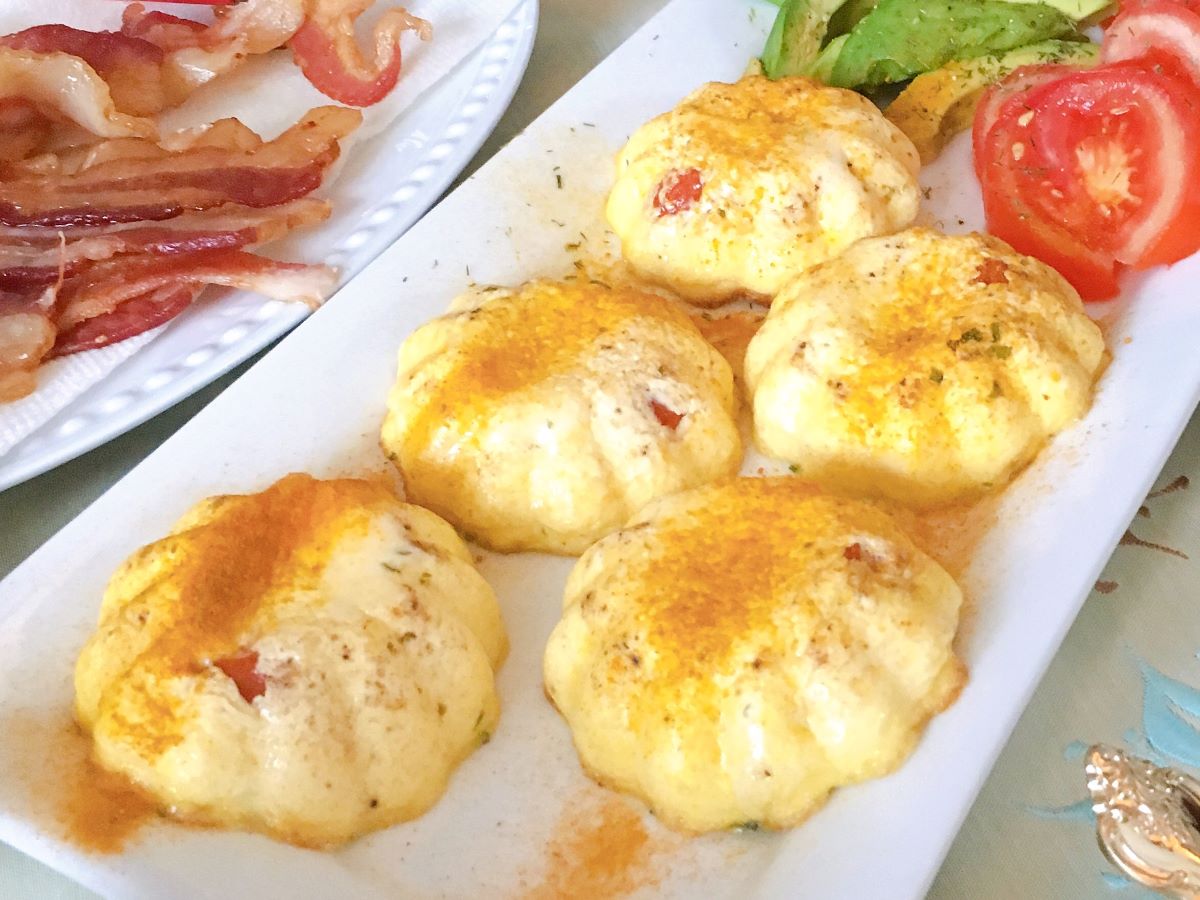 Eggs, tomato and avocado plate served family style