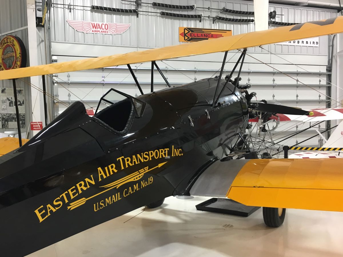 Black and yellow Biplane used to transport mail long ago at Eagles Mere Air Museum.