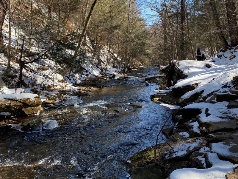 The river with snowy rocks on either side.