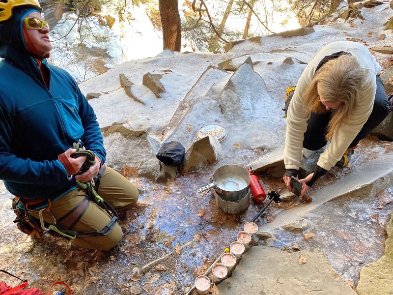 Tour guide making hot chocolate on our ice hike during a break.