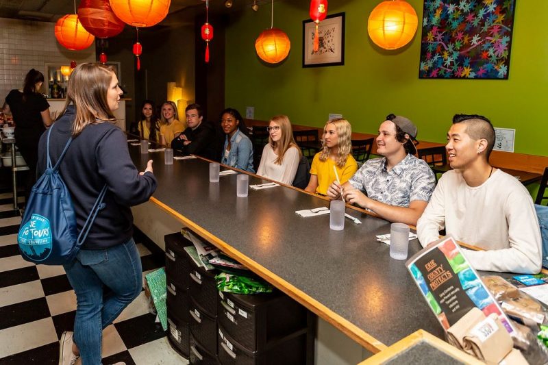 Erie Food Tours group enjoying a storyteller.