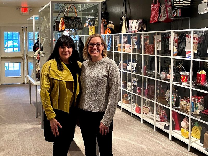 Standing in front of the purse collection with Ilene Hochberg Wood. 