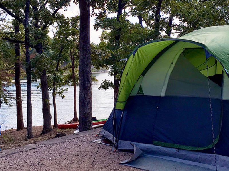 tent on a wooded site overlooking the watrer at Buckhorn family friendly campground in OK