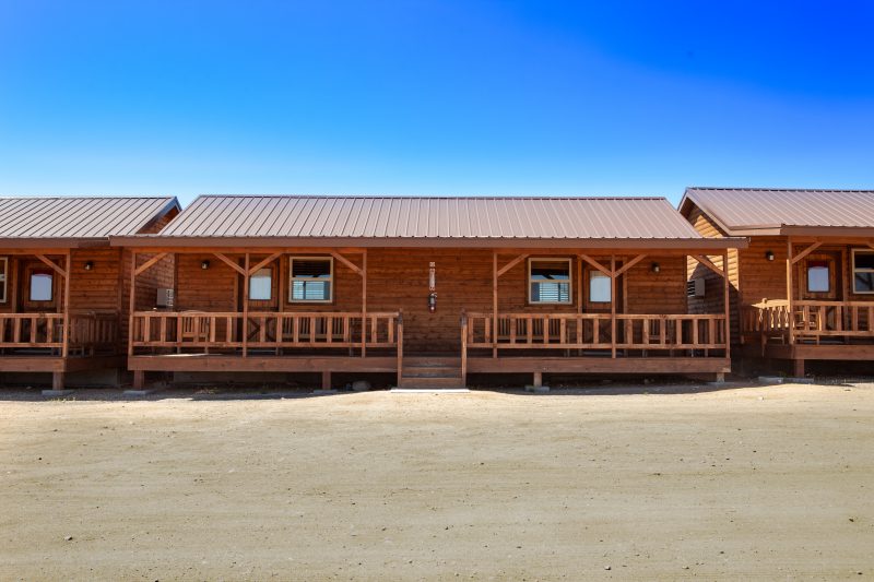 Hualapai cabins at Grand Canyon West, rustic accommodations that offer a chance to unplug and reconnect with each other and with nature. Great sunset views over the Grand Canyon from the porches.