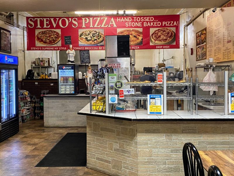 Ordering counter and menu at Stevos, the best pizza place in Erie, PA