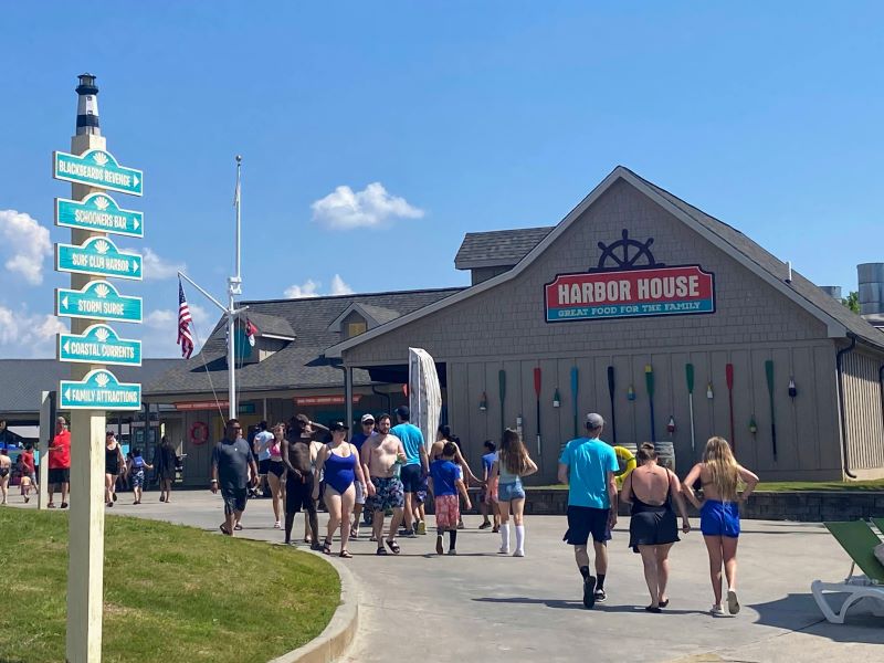 Exterior of Harbor House restaurant at Carowinds, with boat paddles on the wall.