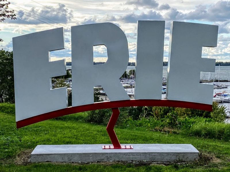 Visit ERIE, PA sign with marina at Lake Erie in background