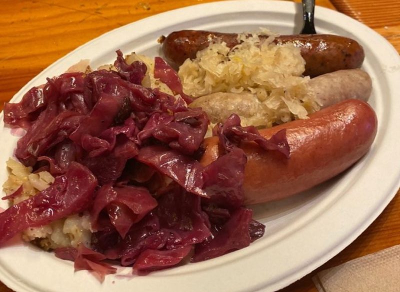 Three sausage platter with German coleslaw at Das Festhaus, an option on the busch gardens meal deal plan