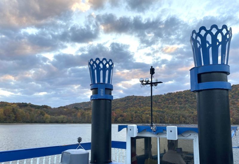 Smokestacks of the Showboat Proud Mary  -- black stacks with blue rings -- and the mountains beyond