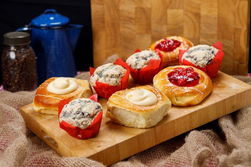 Dollywood Resort pastries are one of the food offerings available at Dollywood in Pigeon Forge, shown here cheese and cherry pastries and blueberry muffins on a cutting board