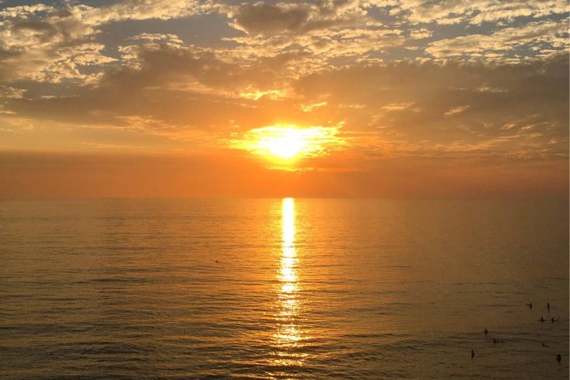 sunset on the pacific ocean at san elijo family camping in California