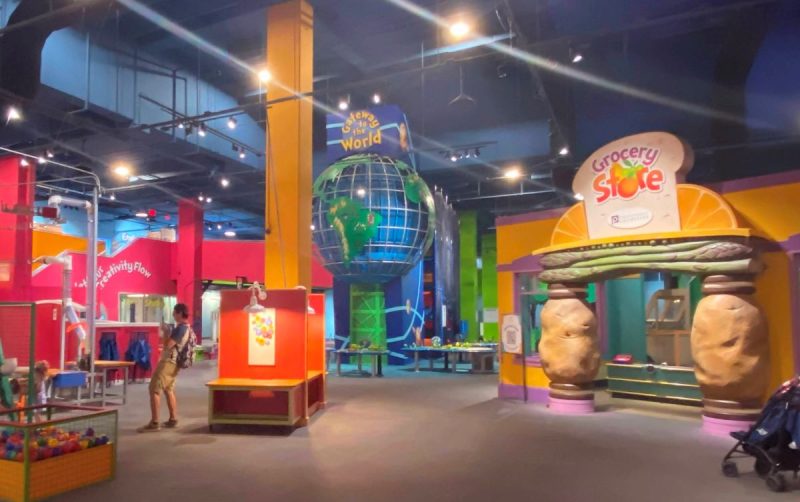 Open spaces at the Children's Museum of Atlanta include exhibits like a grocery store, giant globe to climb in, ball area to explore physics and more