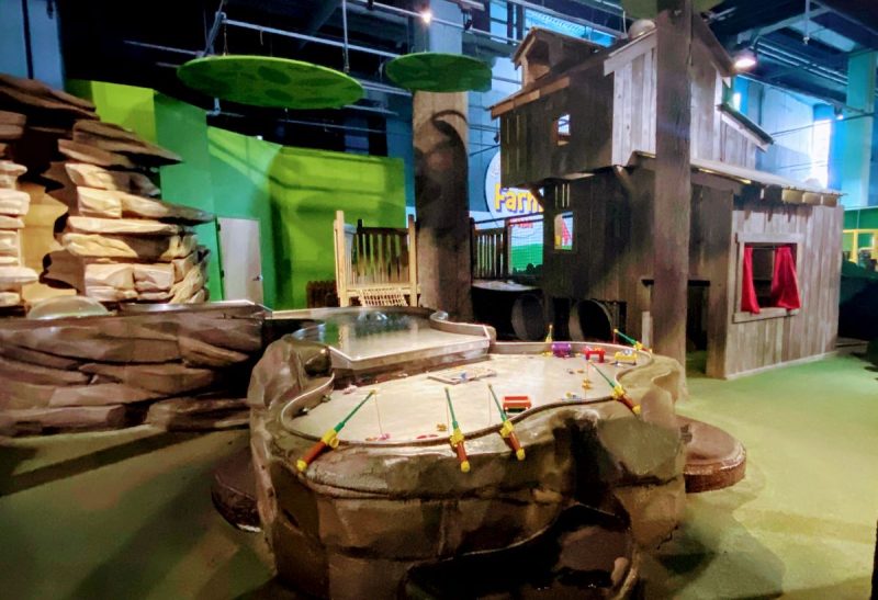 Water table with fishing poles and treehouse for kids ages 0-5 in the Leaping into Learning exhibit at the CMA