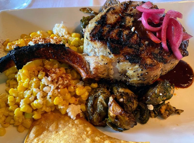 Grilled pork chop with corn and pickled onions at Saluda's in Five Points, Columbia