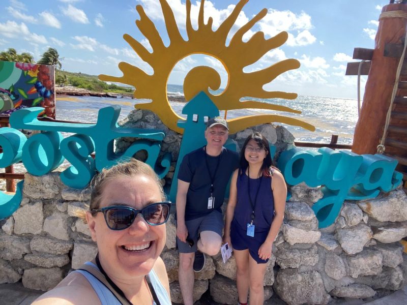 dressed for comfort -- an important aspect of what to wear on a Caribbean cruise. family here in shorts and t-shirts with comfortable walking shoes in front of a Costa Maya sign