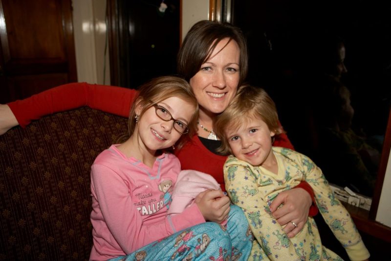 Mom and two kids in PJs on the Grapevine Christmas Train