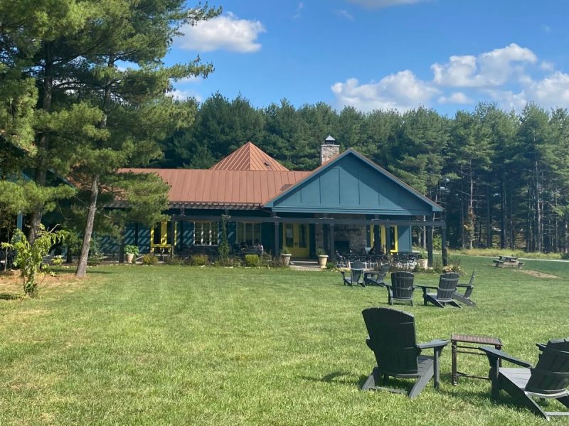 The grounds at Walsh Family Wines provide places to sit and enjoy wine while kids play nearby. The covered porch provides shade.
