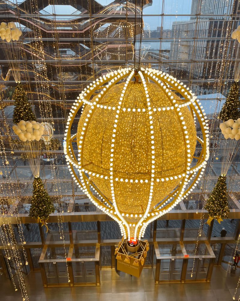 Hudson Yards shopping in NYC, with a giant hot air balloon decorated in lights