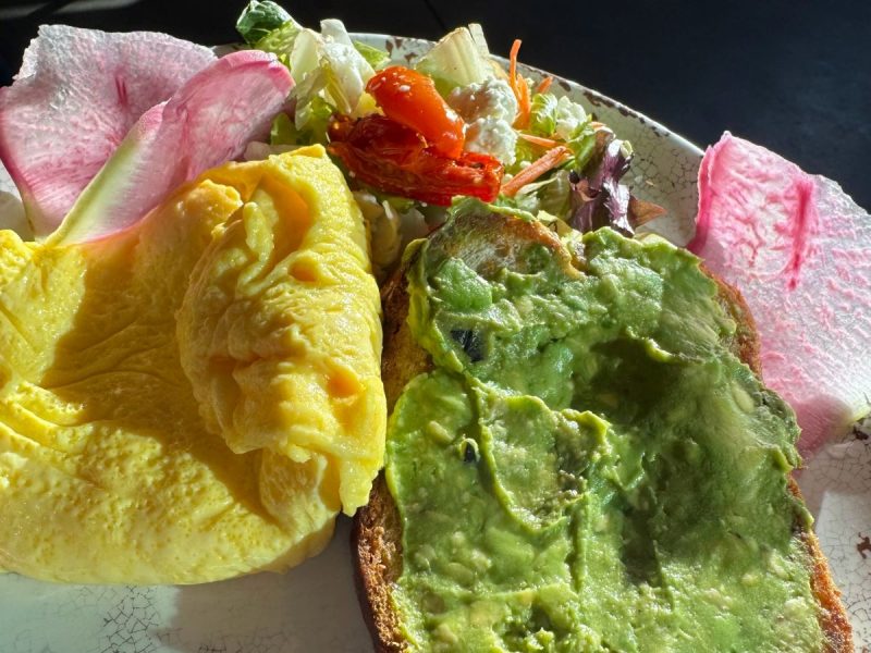 Avocado toast with eggs and salad.