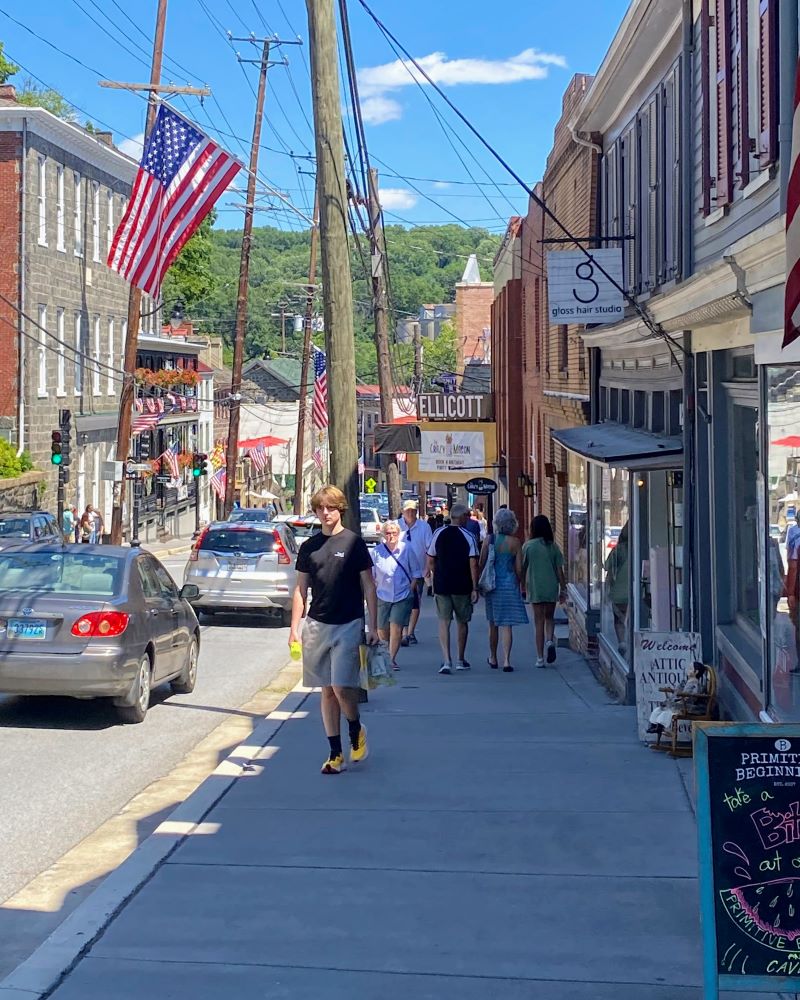 Main Street Ellicott City with people walking along the sidewalks.