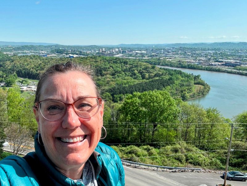 Selfie from the top of the Ruby Falls castle with Chattanooga and the Tennessee River in the background.
