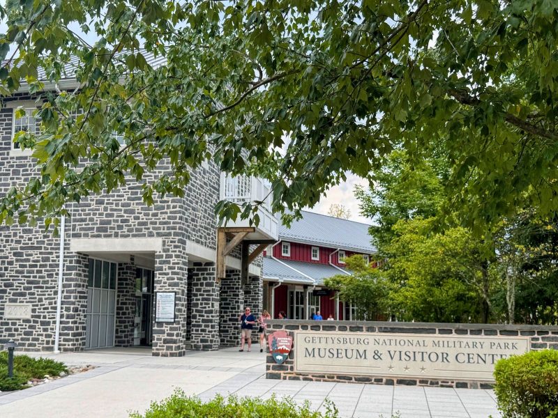 Entrance to Gettysburg Nnational Military Park Museum and Visitor Center with tree in foreground.