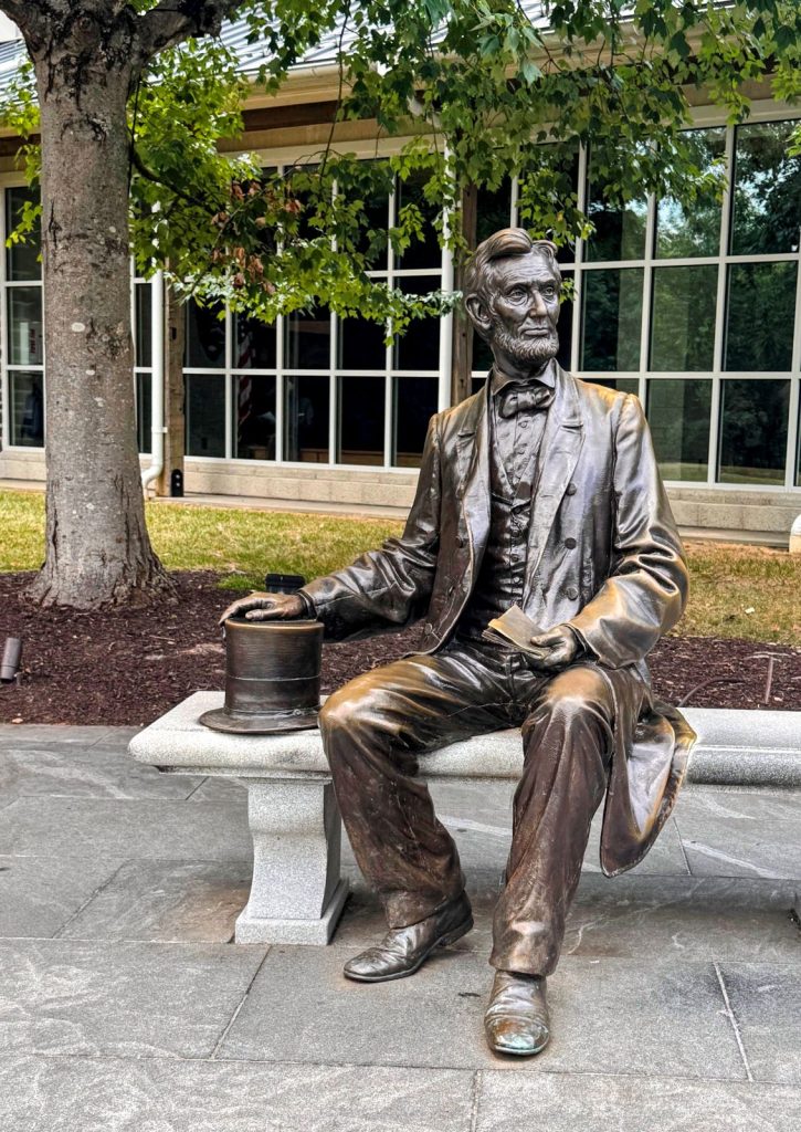 Statue of Lincoln with folded paper in hand in Gettysburg, PA.